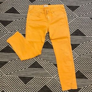 Free People mid / high rise jeans pants-marigold color, size 29, run slim.